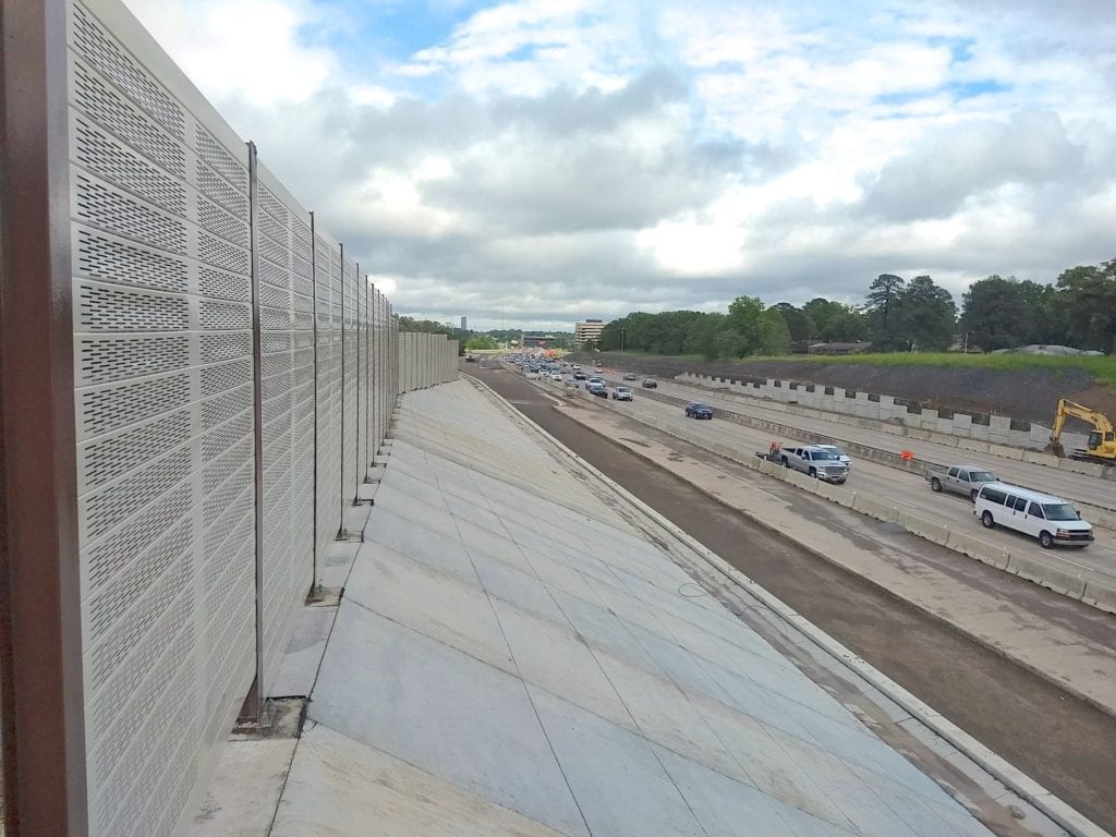 Close angle view of structure-mounted sound barrier wall along I-630