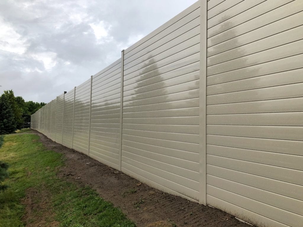 Close-up view of railway sound barrier wall around condo development