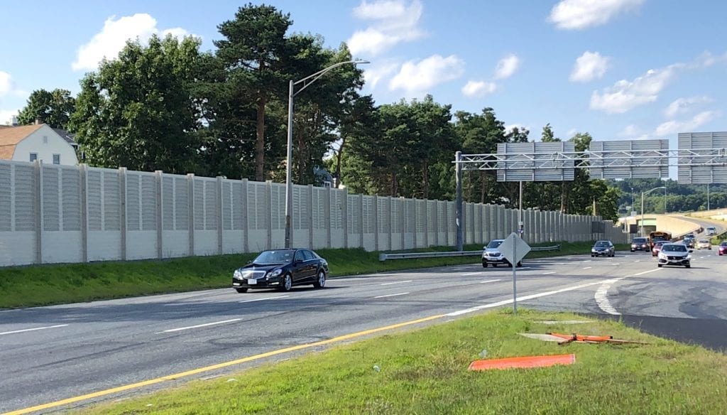 Expansive view of MassDOT highway sound barrier wall replacement
