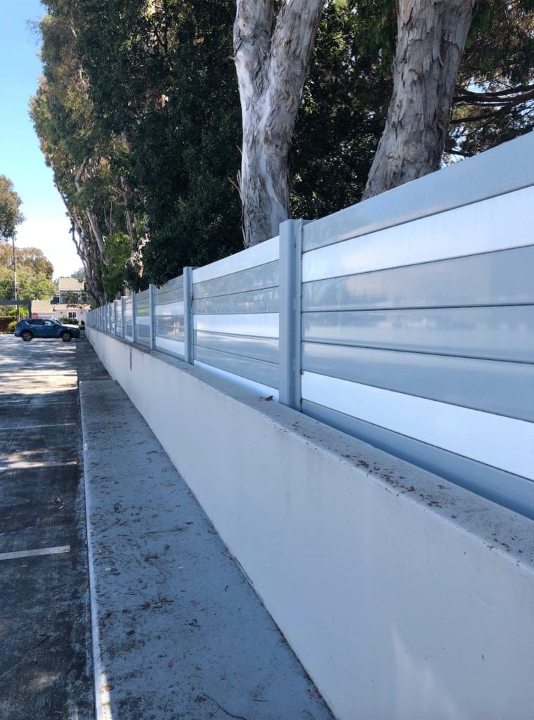 Close-up of sound barrier wall mounted to side of parking structure