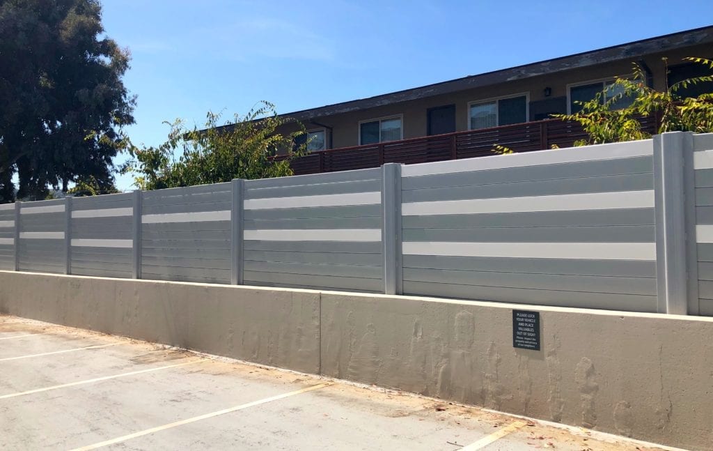 Sound barrier wall mounted to side of parking structure