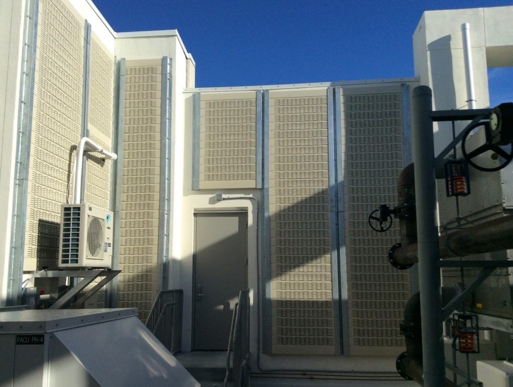 Rooftop mechanical yard walls clad with Silent Protector Absorptive system