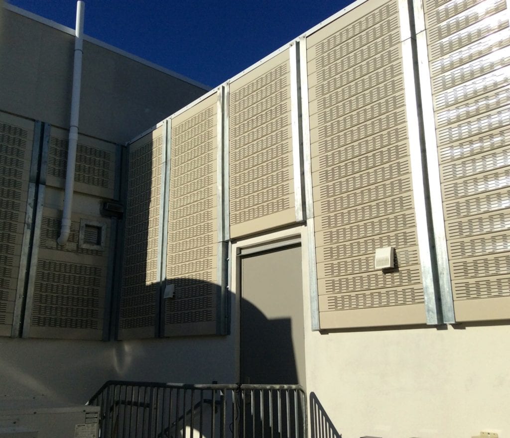 Doorway in rooftop mechanical yard walls clad with AIL Sound Walls