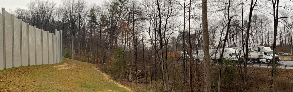 : Exterior views of residential development noise barrier wall along I-95