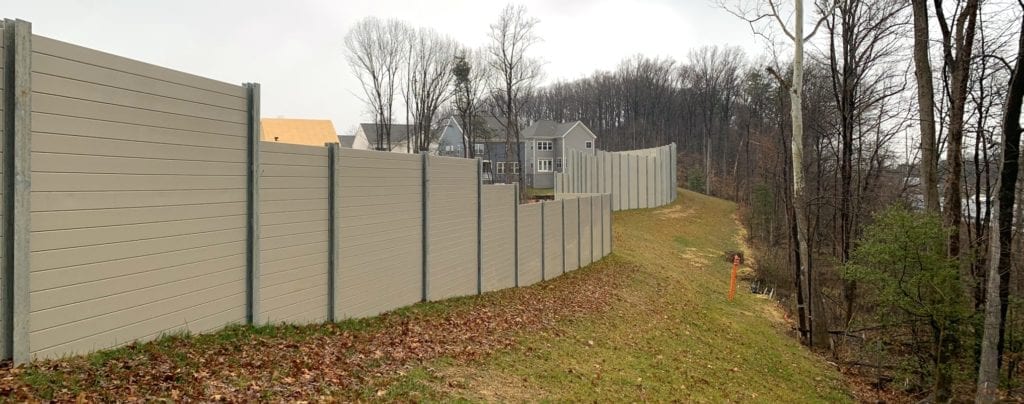 : Exterior views of residential development noise barrier wall along I-95