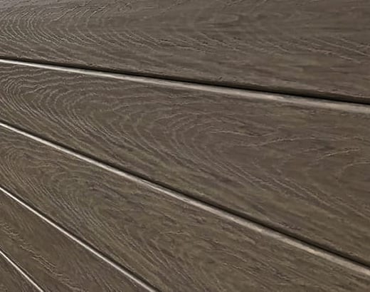 Close-up shot o woodgrain texture on sound barrier wall