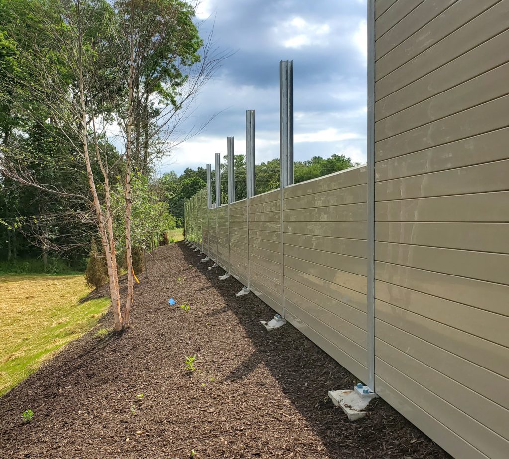 : Panel installation on logistics center sound barrier wall