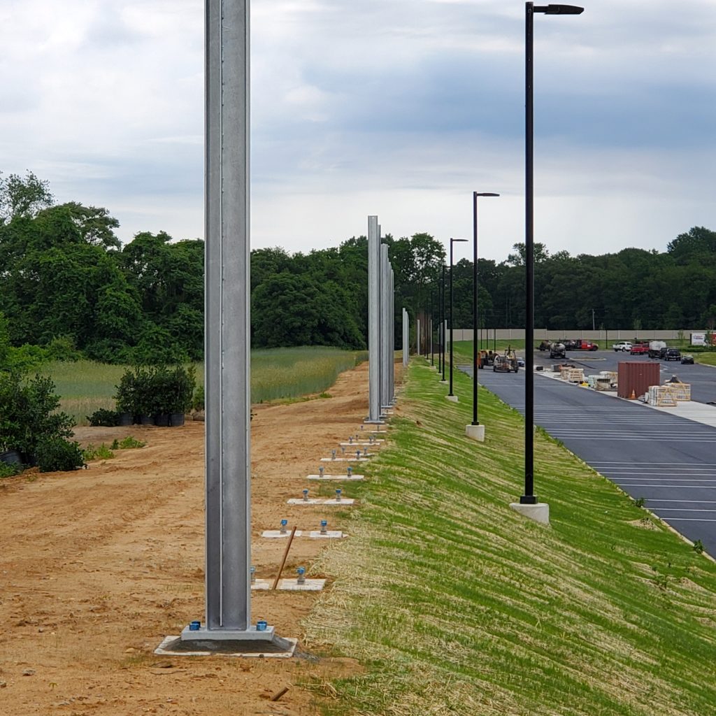 : Post installation for distribution center noise barrier wall