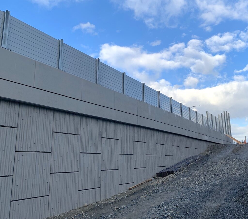 LRT sound barrier wall on retaining wall