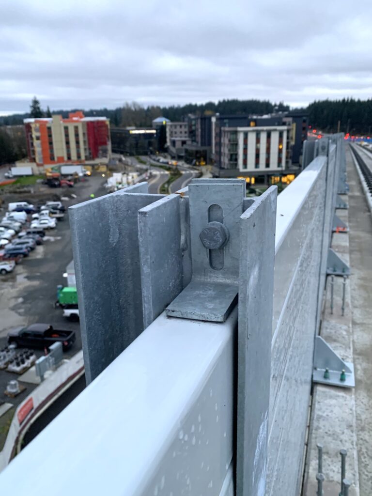 Close-up-of-noise barrier wall stanchion on LRT guideway