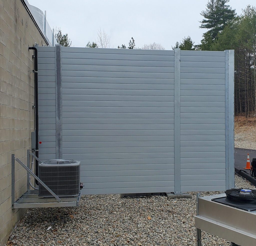 End of noise barrier wall equipment enclosure