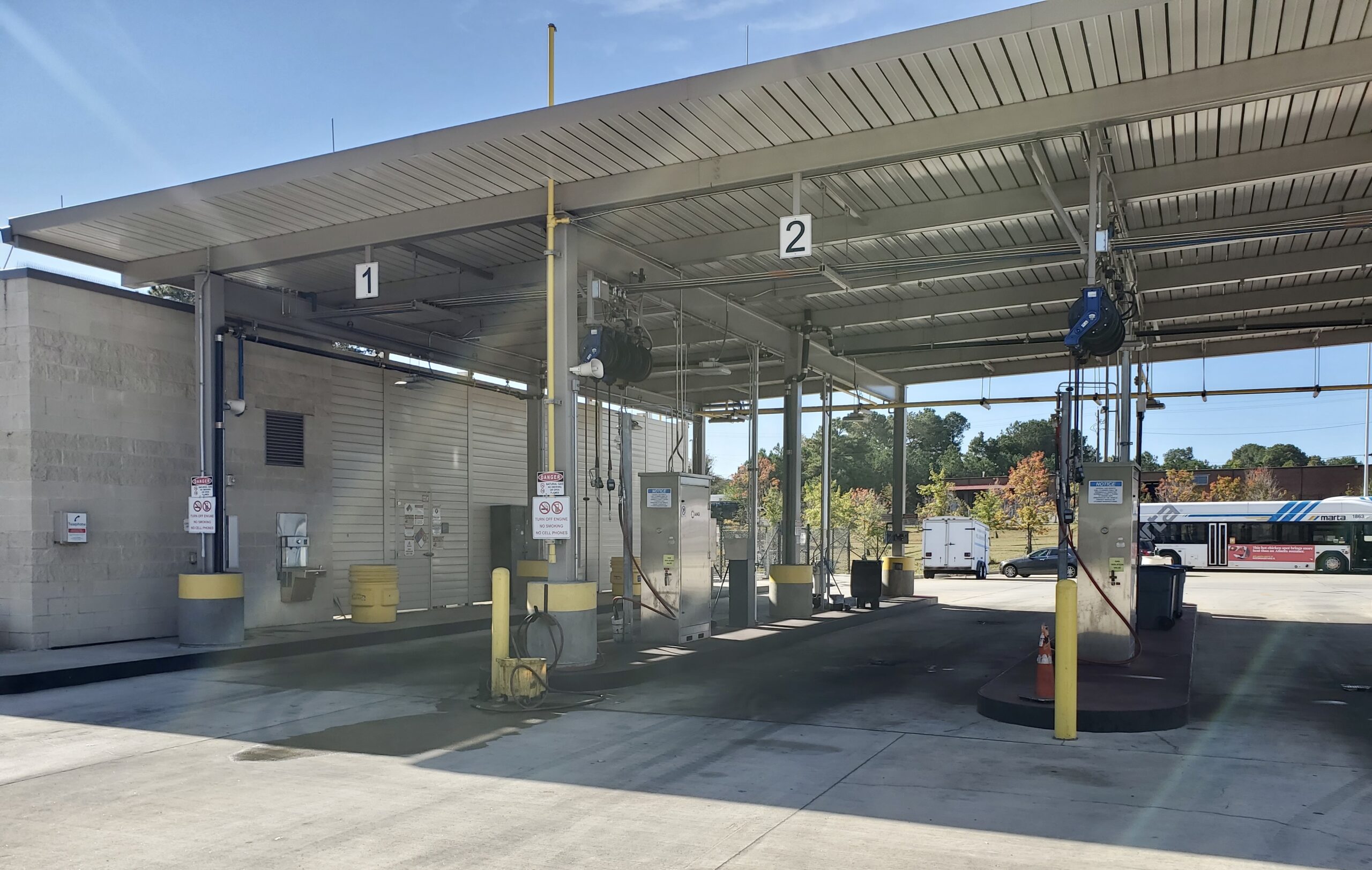 Atlanta CNG bus refueling facility noise barrier wall under canopy