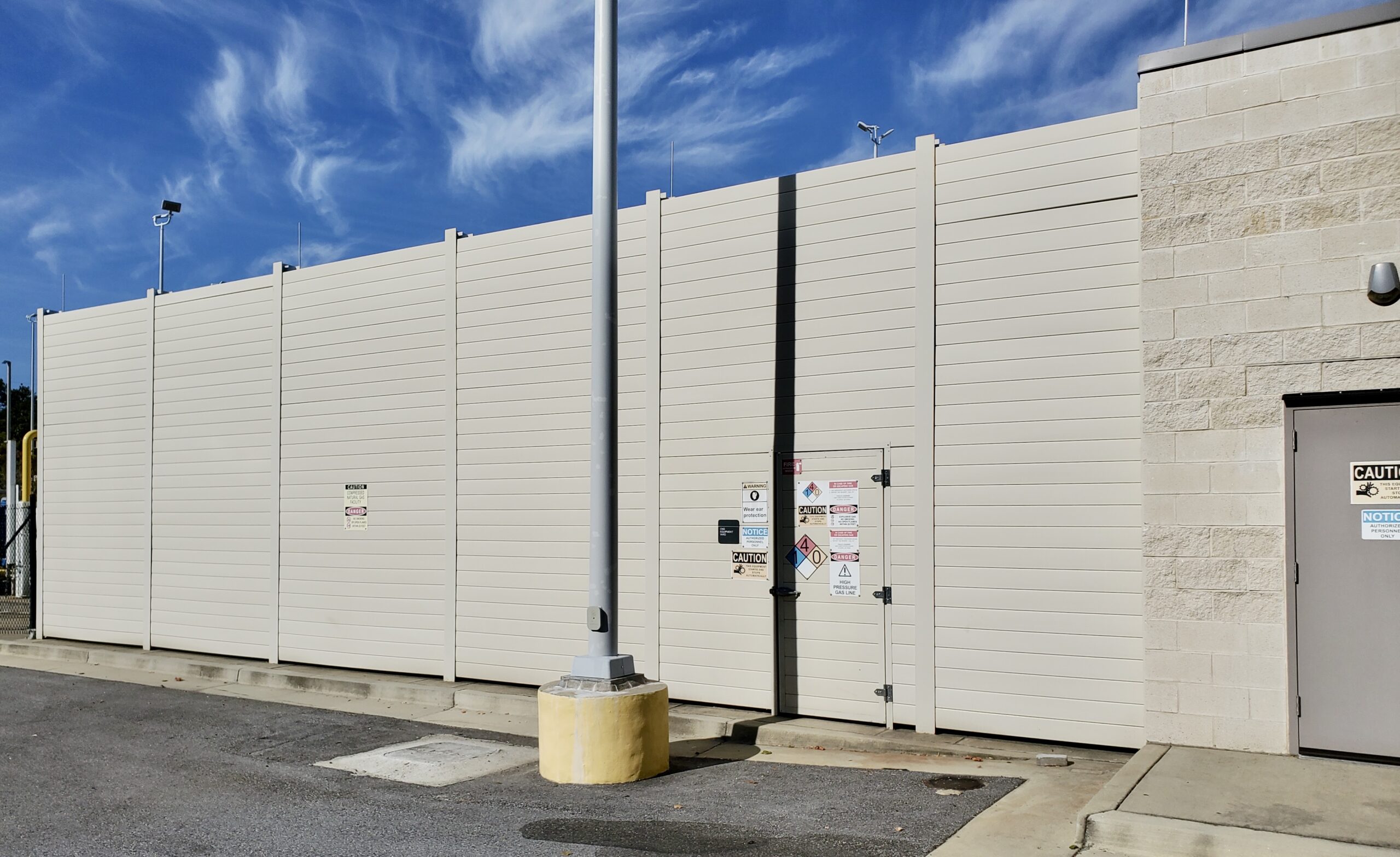 Atlanta CNG bus refueling facility noise barrier wall adjoins building