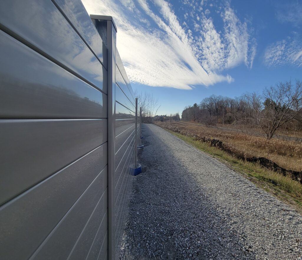 Close-up view of residential development noise barrier wall