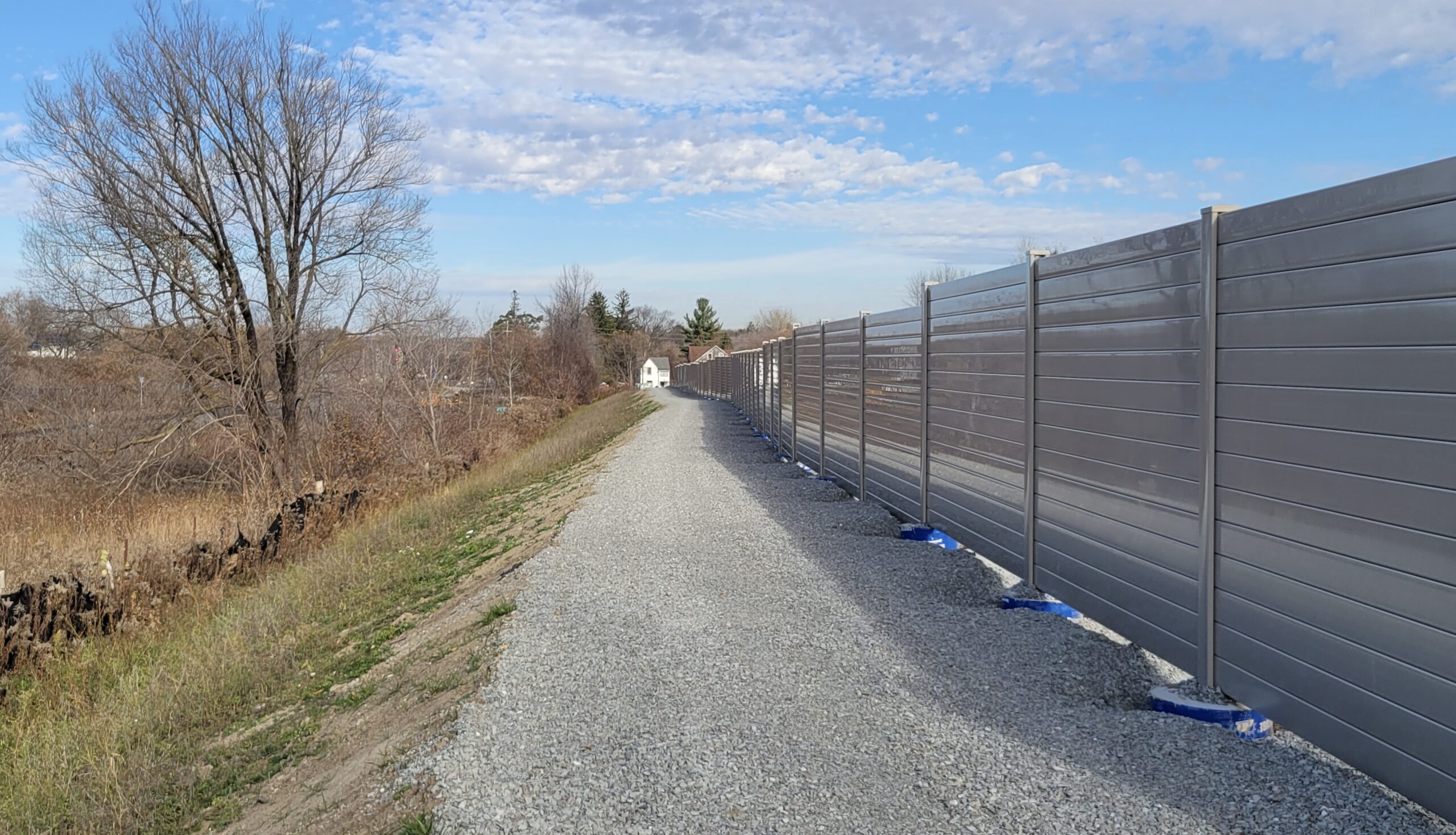 Close-angled view of residential development noise barrier wall