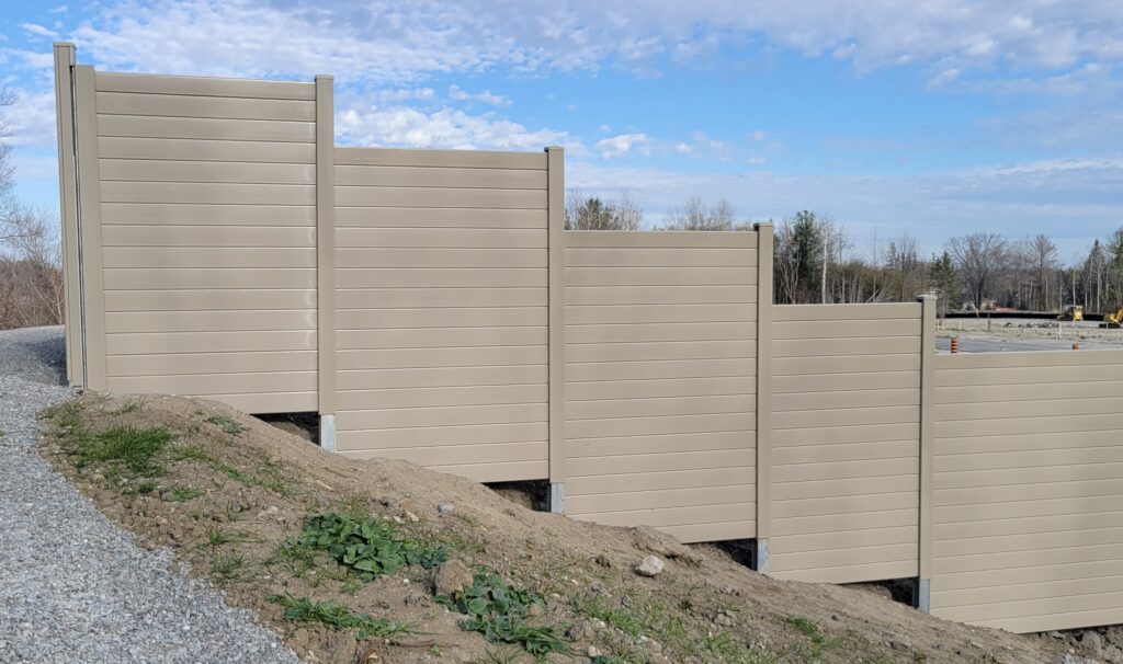 Residential development noise barrier wall on hill