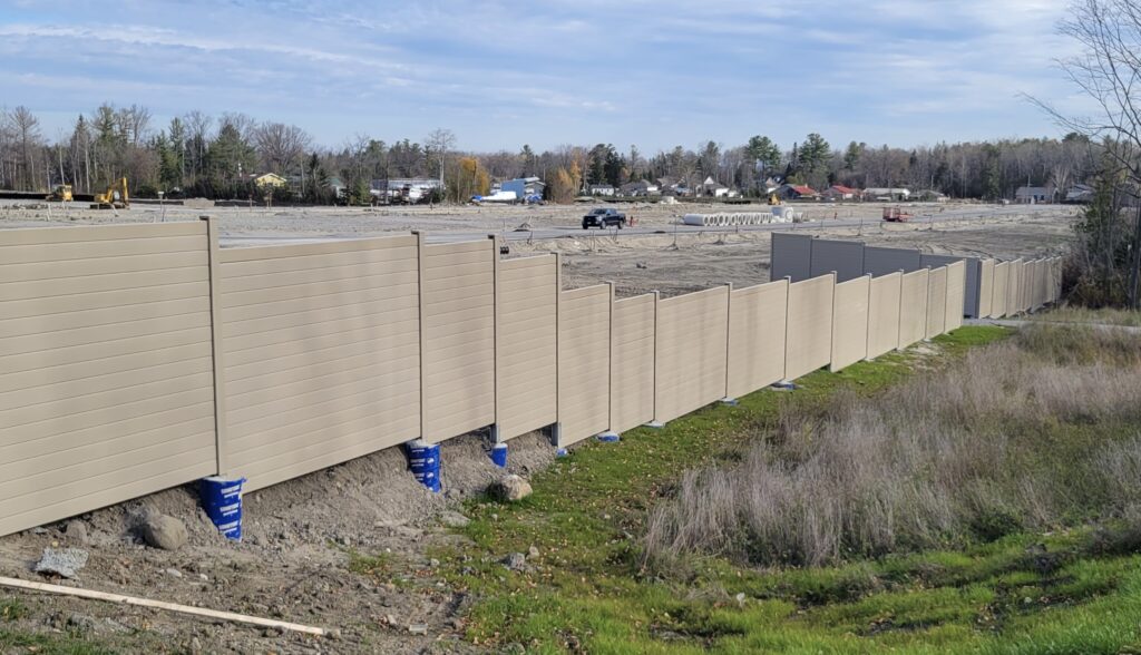 Wide view of residential development noise barrier wall