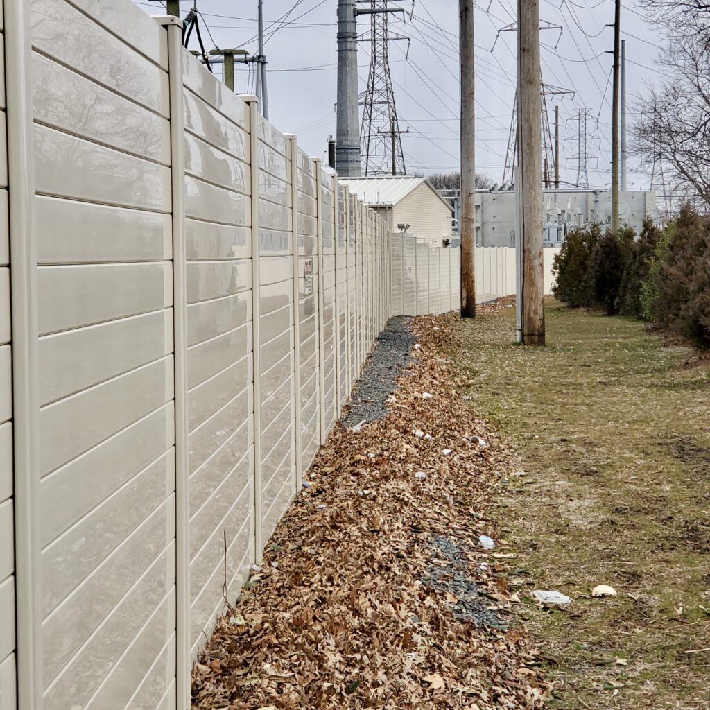 Sharp angle view of electrical switching station noise barrier wall