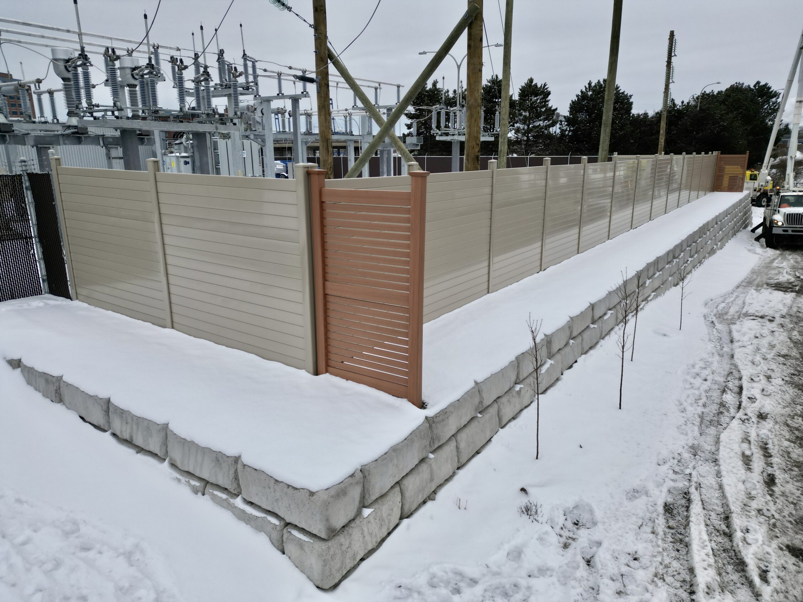 Closer view of electrical utility substation noise barrier wall
