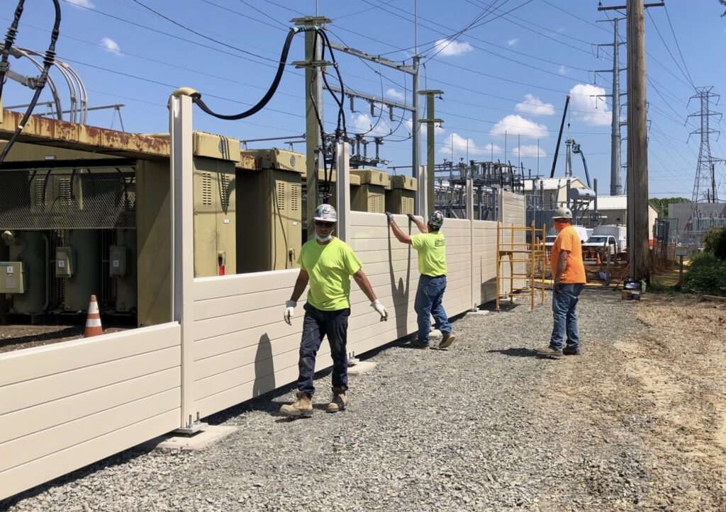 Switching station noise barrier wall panel installation continues