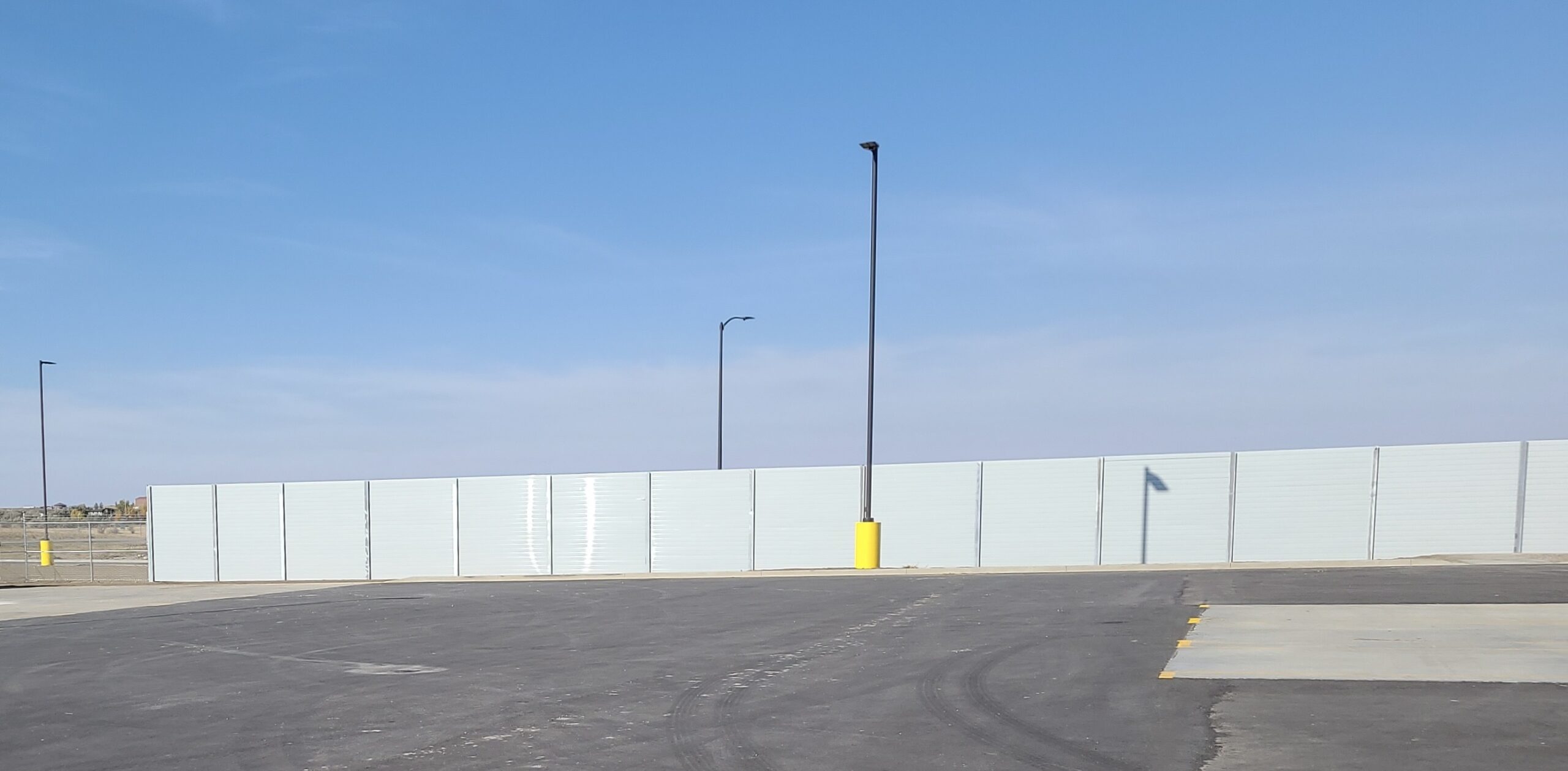 Wide view of sound barrier wall at FedEx logistics center