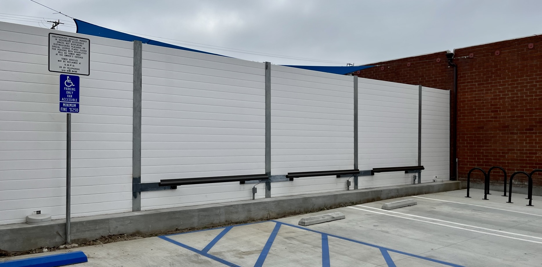 Wide exterior view of sound wall at dog daycare