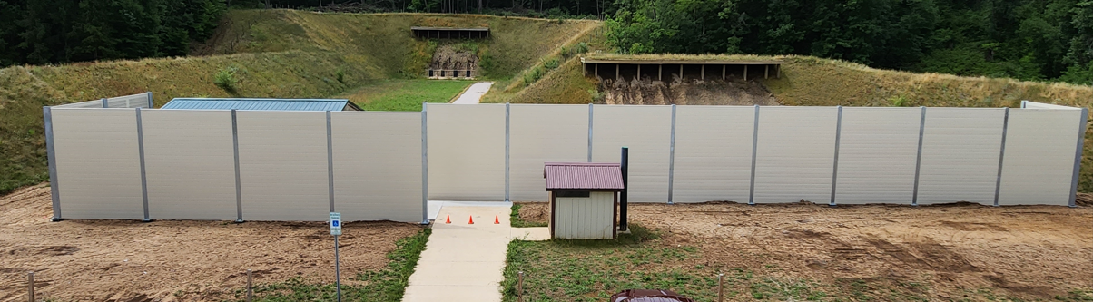 Wide exterior view of sound barrier wall at shooting range