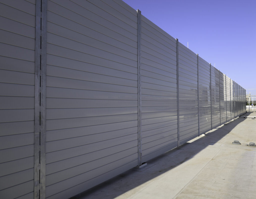 Wide view of sound barrier wall equipment enclosure