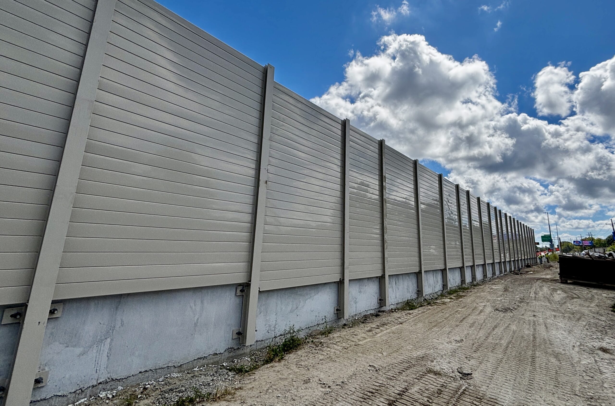 Wide view of structure-mounted sound barrier wall