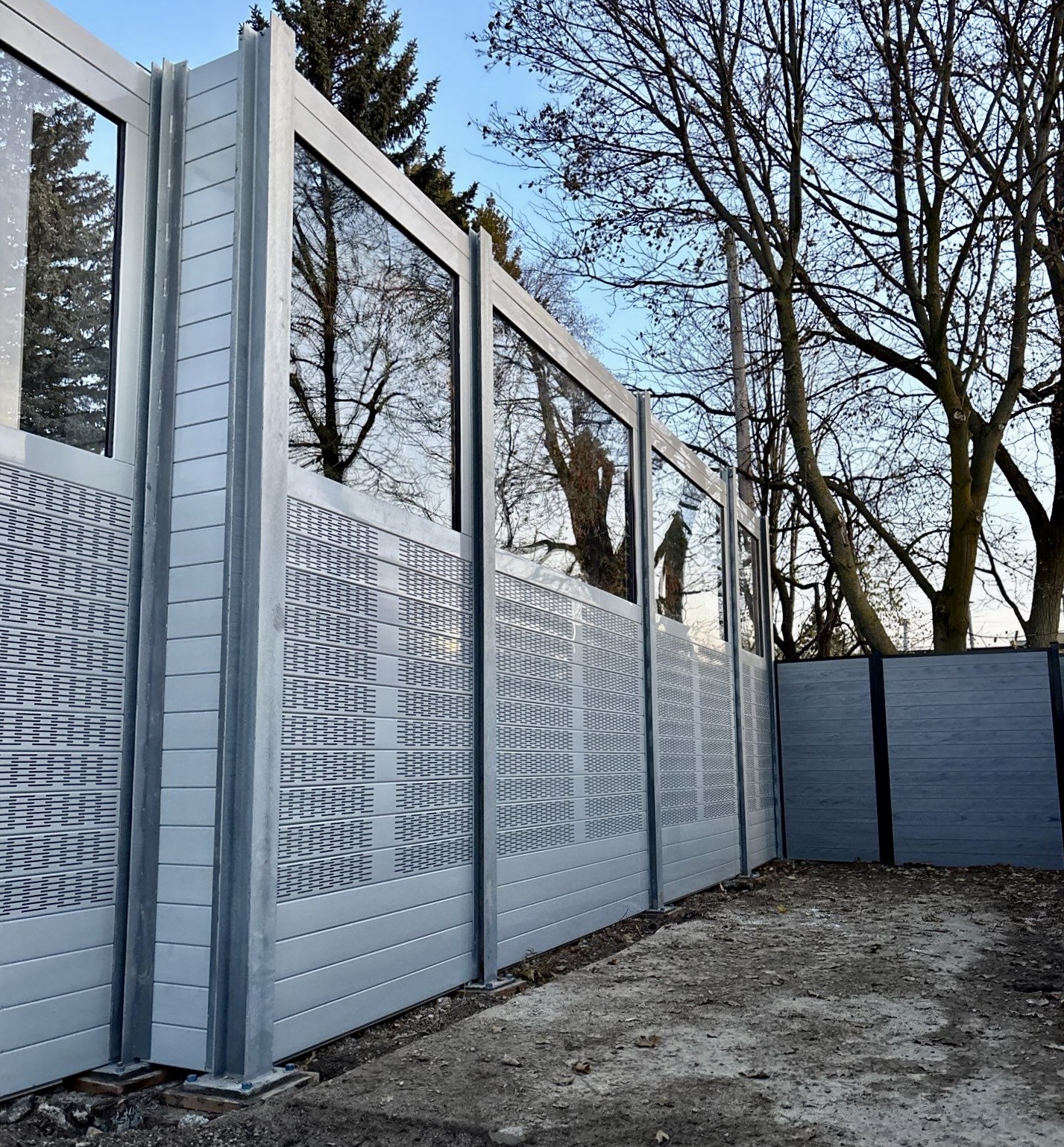 Angled view of sound barrier wall for-dog-daycare-yard