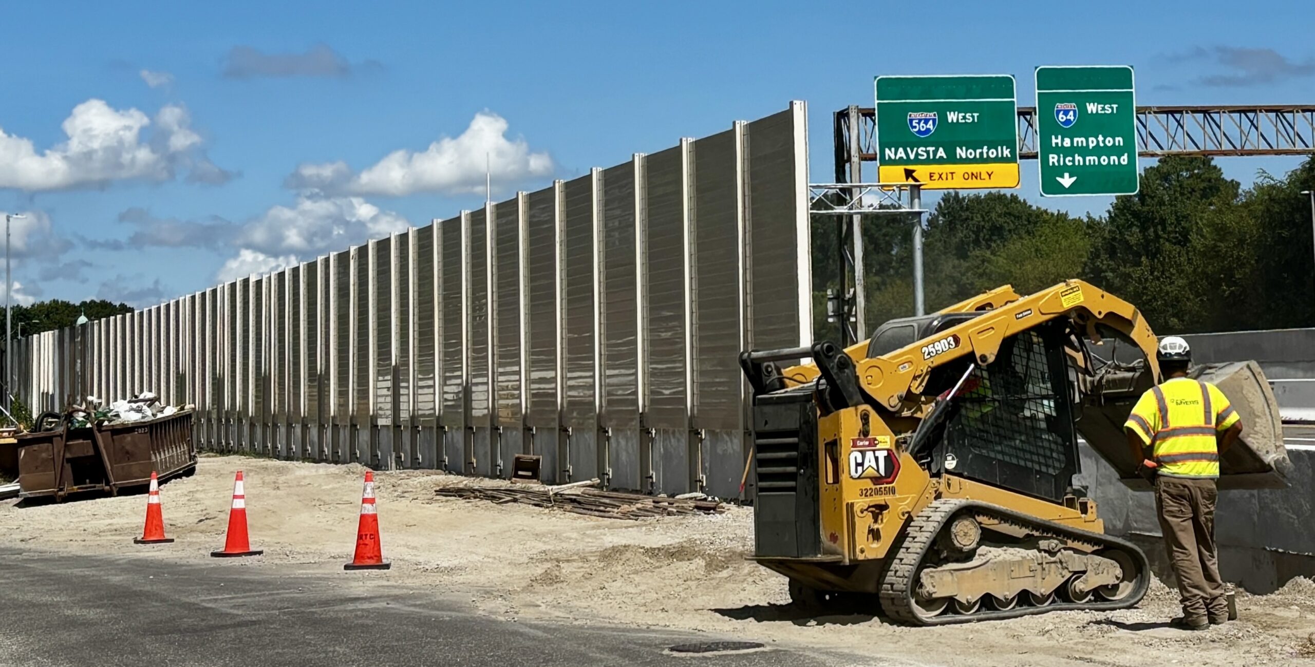 Wide view of highway sound barrier wall installation