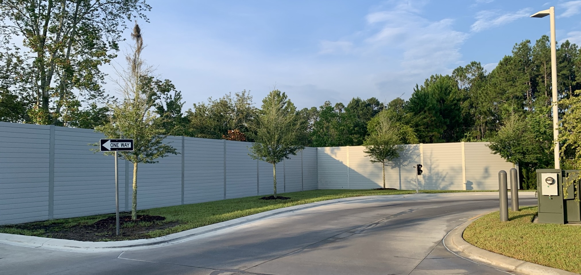 Wide view of noise barrier wall for Gate Carwash